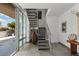 Home interior showing stairs, modern decor, and floor-to-ceiling windows with a view at 1365 Harbor Dr, Sarasota, FL 34239