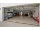 Large garage with storage, workspace, and a translucent glass door at 1365 Harbor Dr, Sarasota, FL 34239