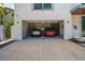 Spacious two-car garage featuring two luxury vehicles at 1365 Harbor Dr, Sarasota, FL 34239