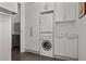 Modern laundry room featuring a stacked washer and dryer at 1365 Harbor Dr, Sarasota, FL 34239