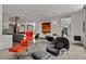Open living room with modern furniture, eye-catching light fixture, and decorative wall art at 1365 Harbor Dr, Sarasota, FL 34239