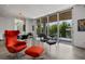 Open concept living room with floor to ceiling sliding glass doors leading to a balcony at 1365 Harbor Dr, Sarasota, FL 34239