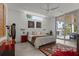 Bright bedroom with a ceiling fan and a large window at 1365 Harbor Dr, Sarasota, FL 34239