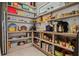 Walk-in pantry with wooden shelving and a variety of food items at 1365 Harbor Dr, Sarasota, FL 34239