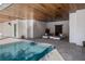 Beautiful outdoor living space features a covered patio with a pool and modern seating area at 1365 Harbor Dr, Sarasota, FL 34239