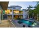 Luxury outdoor living featuring a large pool, lounge chairs, and landscaped backyard at 1365 Harbor Dr, Sarasota, FL 34239