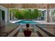 Beautifully designed outdoor space featuring a pool, lounge area, and lush bamboo backdrop at 1365 Harbor Dr, Sarasota, FL 34239