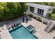 Aerial view of a backyard with a pool, jacuzzi, lounge chairs, and modern architecture at 1365 Harbor Dr, Sarasota, FL 34239