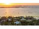 An elevated view of a body of water, with sail boats, during the sunset at 1365 Harbor Dr, Sarasota, FL 34239