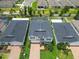 An aerial view shows the home's brick driveway and manicured landscaping at 14363 59Th E Cir, Lakewood Ranch, FL 34211