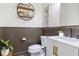 Stylish half bathroom featuring bead board paneling and modern fixtures at 14363 59Th E Cir, Lakewood Ranch, FL 34211