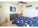 Bedroom featuring galaxy themed bedding, a ceiling fan, dresser, and a window with blinds at 14363 59Th E Cir, Lakewood Ranch, FL 34211