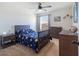 Bedroom featuring galaxy themed bedding, a ceiling fan, dresser, and a window with blinds at 14363 59Th E Cir, Lakewood Ranch, FL 34211