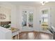 Bright entryway with glass pane doors offering a glimpse into the playroom at 14363 59Th E Cir, Lakewood Ranch, FL 34211