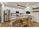 Modern kitchen with granite counters, stainless appliances, white cabinets, and a central island at 14363 59Th E Cir, Lakewood Ranch, FL 34211