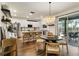 Bright kitchen featuring white cabinets, stainless steel appliances, island and an adjacent dining area at 14363 59Th E Cir, Lakewood Ranch, FL 34211