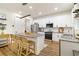 Spacious kitchen offers stainless steel appliances, a center island with seating, and ample cabinet space at 14363 59Th E Cir, Lakewood Ranch, FL 34211