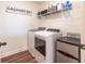 Well-organized laundry room with updated washer, dryer, and ample shelving at 14363 59Th E Cir, Lakewood Ranch, FL 34211