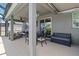 Large covered patio includes a dining area and a lounging section at 14363 59Th E Cir, Lakewood Ranch, FL 34211