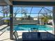 Relaxing screened pool area with dining and lounge seating, with water feature at 14363 59Th E Cir, Lakewood Ranch, FL 34211