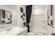 Clean and modern bathroom featuring a single sink vanity and a shower-tub combination at 15149 Cuzcorro Ct, Nokomis, FL 34275