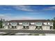 Beautiful townhome row with neutral paint and garage doors under a blue sky at 15177 Cuzcorro Ct, Nokomis, FL 34275