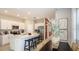 Modern kitchen featuring stainless steel appliances and a large center island at 15177 Cuzcorro Ct, Nokomis, FL 34275