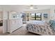 Bright bedroom featuring lots of natural light, a large dresser, and a beach themed comforter at 175 Kings Hwy # B5, Punta Gorda, FL 33983