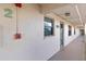 Exterior hallway with unit number, stucco siding and outdoor lighting at 175 Kings Hwy # B5, Punta Gorda, FL 33983