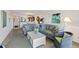 Spacious living room featuring a seating area and connected to the kitchen at 175 Kings Hwy # B5, Punta Gorda, FL 33983