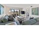 Well-decorated living room with comfortable seating and balcony access at 175 Kings Hwy # B5, Punta Gorda, FL 33983