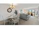 Bright living room with dining area and sliding doors leading to the balcony at 175 Kings Hwy # B5, Punta Gorda, FL 33983