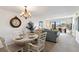 Bright living and dining area with chandelier, large window, and comfortable seating at 175 Kings Hwy # B5, Punta Gorda, FL 33983