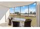 Enjoy the view from this relaxing screened-in patio complete with seating for four at 175 Kings Hwy # B5, Punta Gorda, FL 33983
