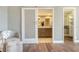 Elegant bathroom entrance with a sliding barn door and a view of a modern vanity at 1750 Benjamin Franklin Dr # 6F, Sarasota, FL 34236