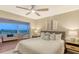 Serene bedroom features plush bedding and a sunroom boasting stunning views for ultimate relaxation at 1750 Benjamin Franklin Dr # 6F, Sarasota, FL 34236