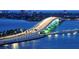 See the illuminated bridge spanning the water, connecting communities in a scenic coastal setting at 1750 Benjamin Franklin Dr # 6F, Sarasota, FL 34236