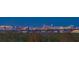 Expansive panoramic night view showcasing a stunning cityscape with twinkling lights amidst lush greenery at 1750 Benjamin Franklin Dr # 6F, Sarasota, FL 34236