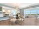 Elegant dining area with a modern chandelier and beautiful views at 1750 Benjamin Franklin Dr # 6F, Sarasota, FL 34236