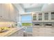 Updated kitchen with stainless appliances, granite countertops and window view at 1750 Benjamin Franklin Dr # 6F, Sarasota, FL 34236