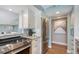 Updated kitchen with stainless appliances, granite countertops and view into the living area for seamless entertaining at 1750 Benjamin Franklin Dr # 6F, Sarasota, FL 34236