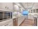 Gourmet kitchen features granite countertops, stainless steel appliances, and custom cabinetry for a high-end feel at 1750 Benjamin Franklin Dr # 6F, Sarasota, FL 34236