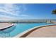 Stunning beachfront pool with ocean views and lounge chairs, perfect for relaxation and recreation at 1750 Benjamin Franklin Dr # 6F, Sarasota, FL 34236