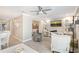 Open-concept living room with comfortable seating, TV, and access to the bedroom, creating a relaxing space at 1800 Gulf N Dr # 112, Bradenton Beach, FL 34217