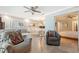 Open-concept living room with a dining area, a view of a bedroom, and lots of natural light at 1800 Gulf N Dr # 112, Bradenton Beach, FL 34217