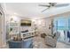 Cozy living room featuring ocean views, balcony access, and ample seating at 1800 Gulf N Dr # 112, Bradenton Beach, FL 34217