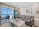 Relaxing living room with balcony access and beautiful ocean views at 1800 Gulf N Dr # 112, Bradenton Beach, FL 34217