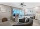 Stylish living room featuring balcony access with stunning ocean views at 1800 Gulf N Dr # 112, Bradenton Beach, FL 34217