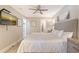 Relaxing bedroom featuring a large bed, bedside tables, and a wall-mounted TV at 1800 Gulf N Dr # 112, Bradenton Beach, FL 34217