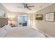 Comfortable bedroom with a large bed, nightstands, TV, and access to a living area at 1800 Gulf N Dr # 112, Bradenton Beach, FL 34217